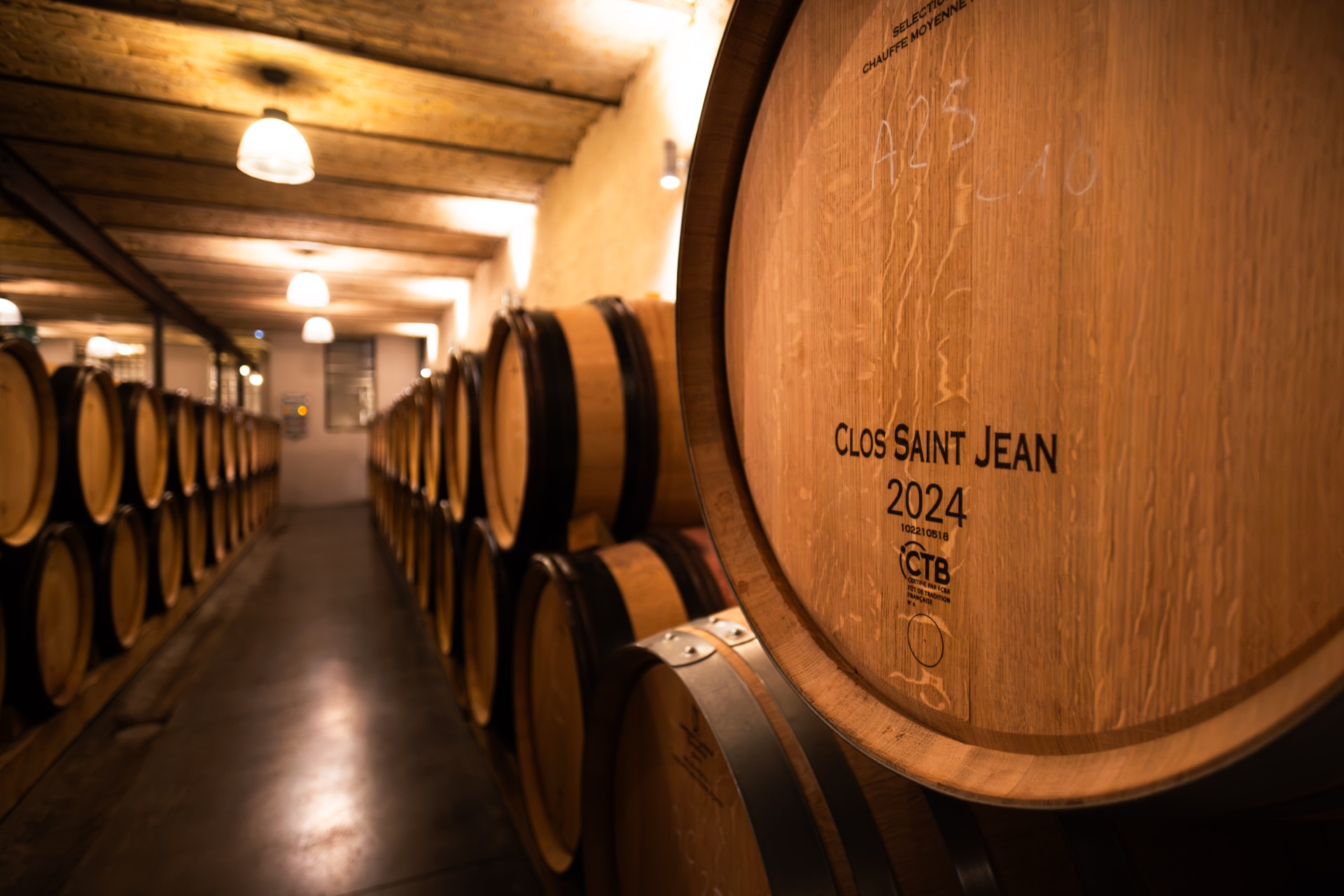 A barrel head branded Clos Saint Jean 2024