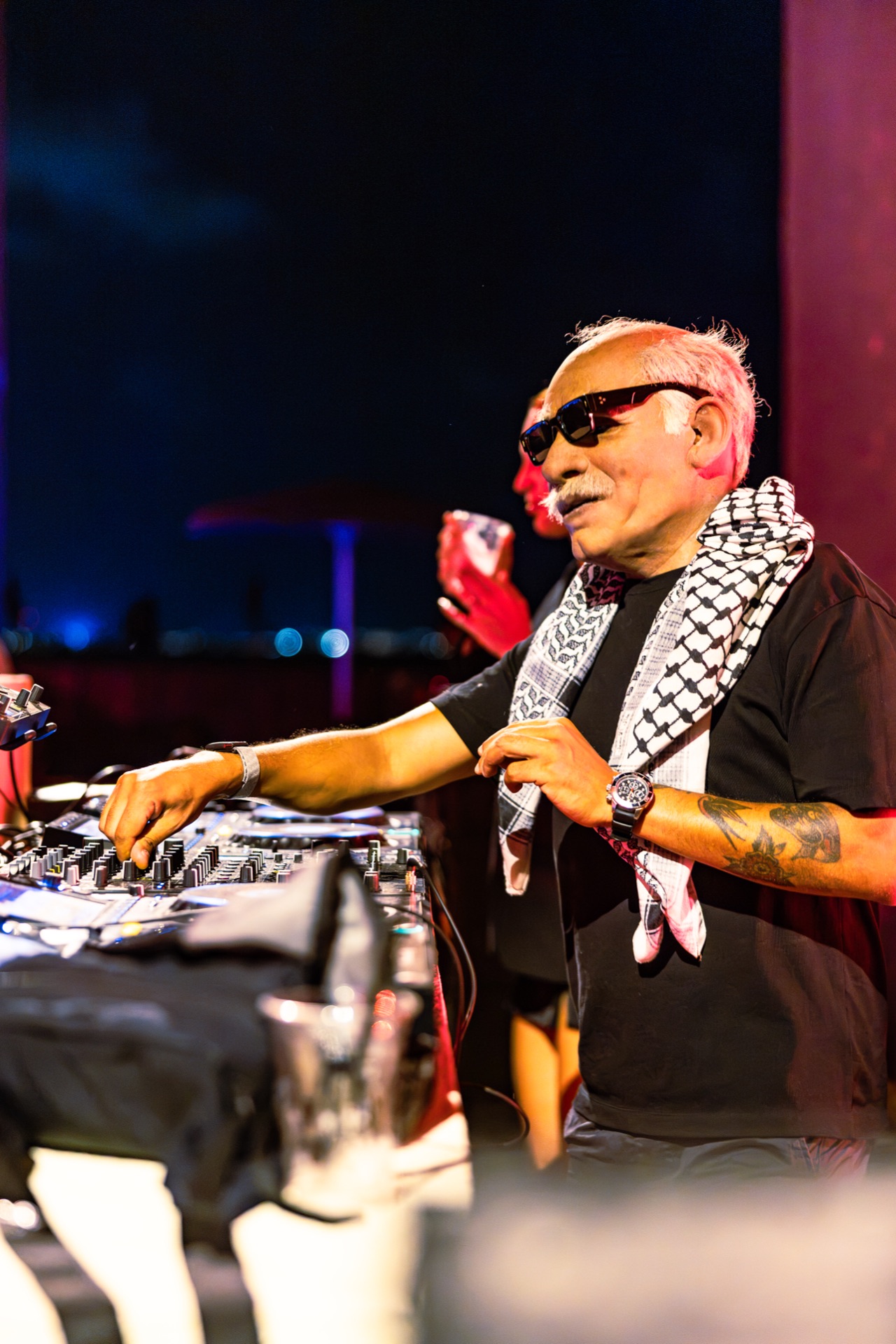 Doctor Alphonso at the decks against the open night sky